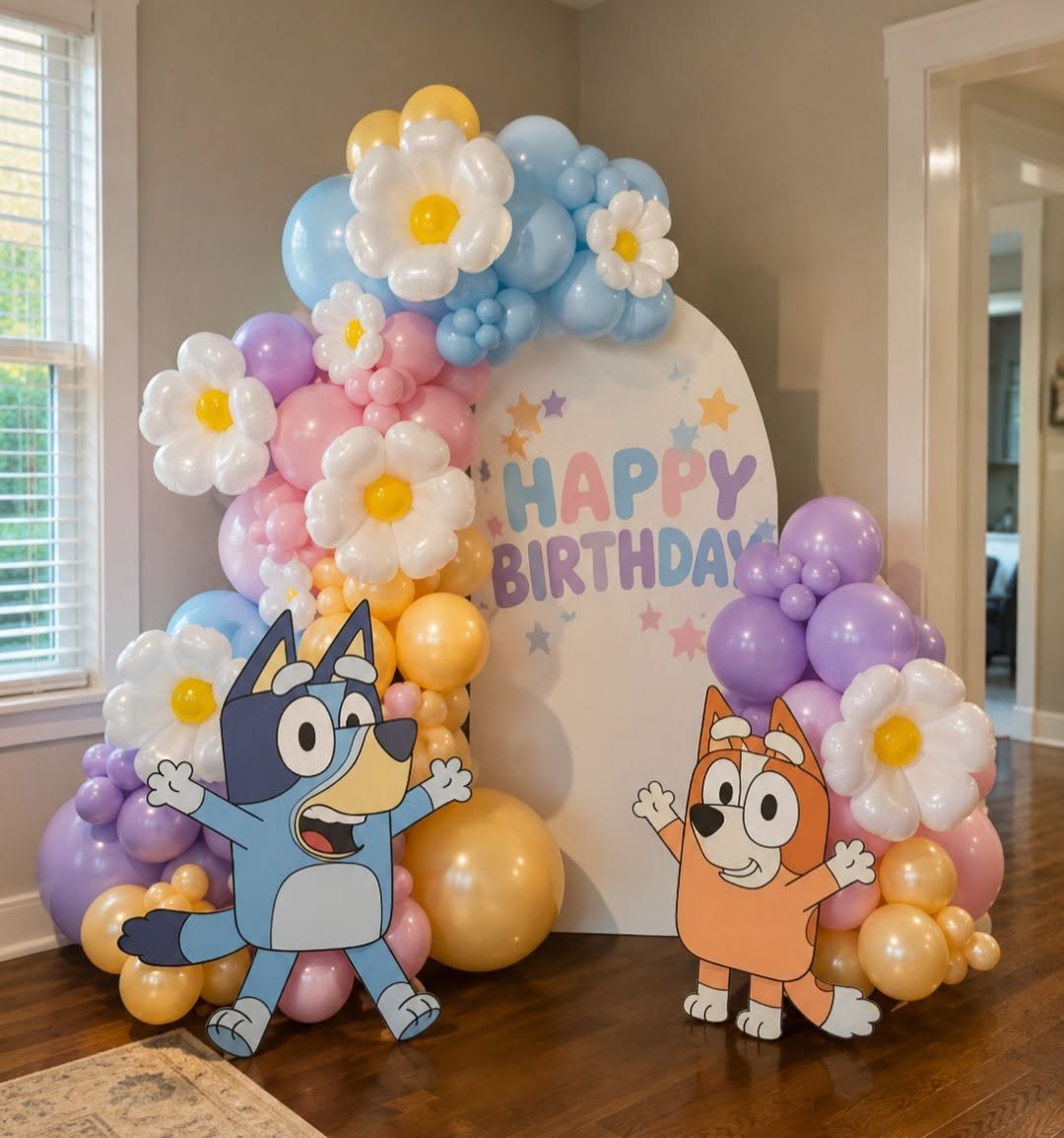 Bluey themed birthday with daisy balloon arch and character cutouts